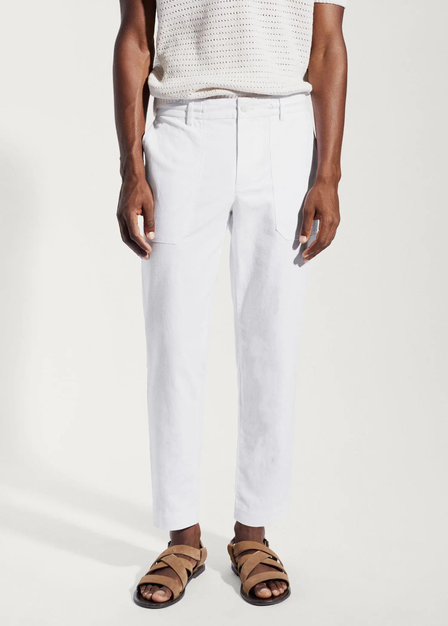 Mango Regular fit cotton linen pants. a man wearing white pants and a white shirt. 