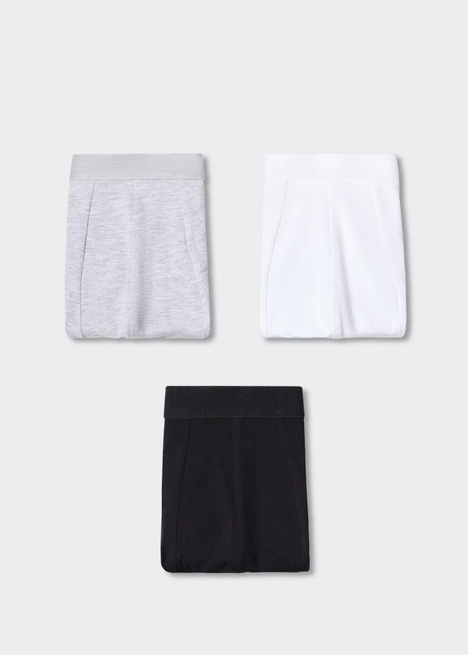 Mango 3-pack cotton boxers. three pairs of shorts on a white wall. 