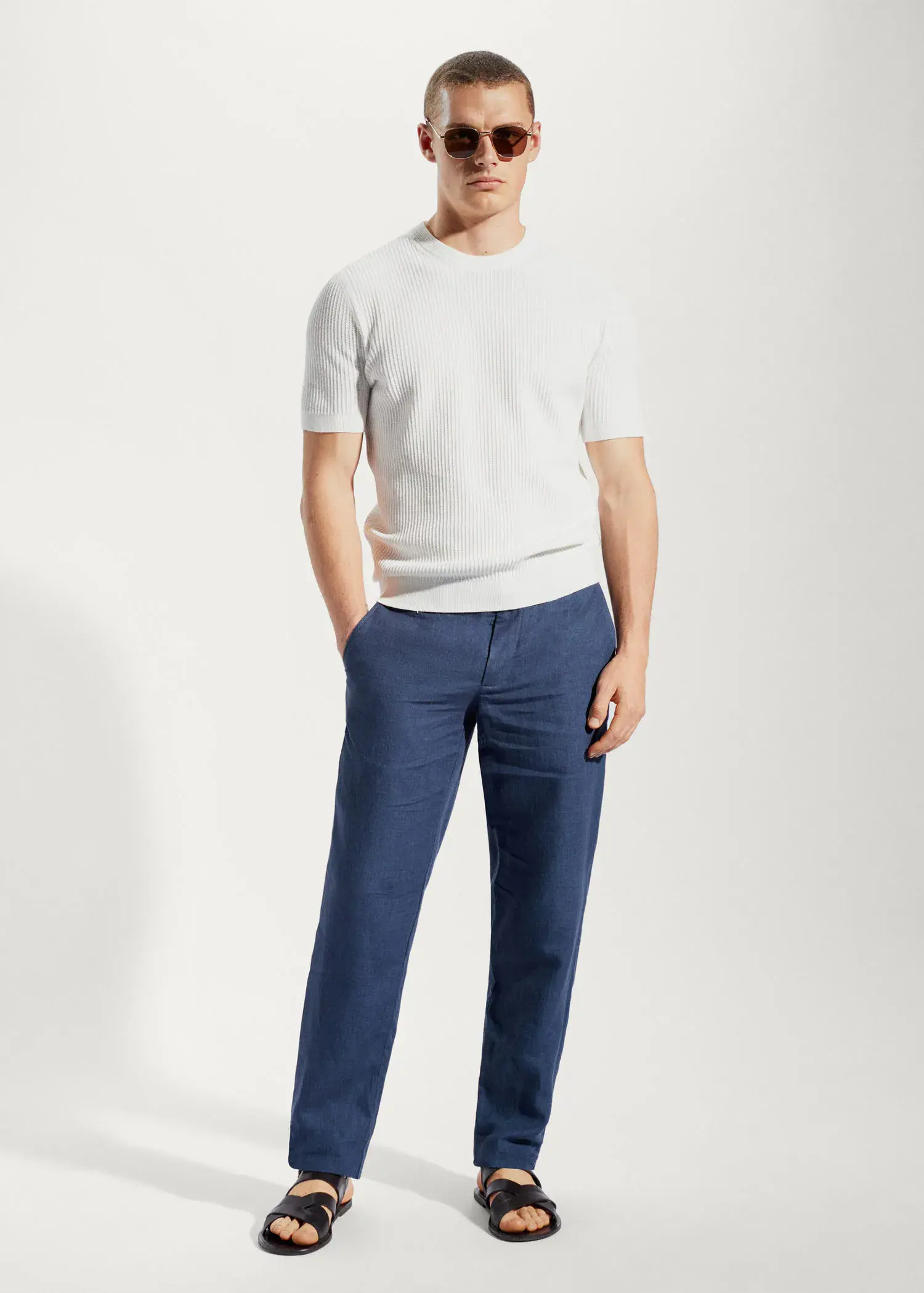 Mango Slim-fit 100% linen pants. a man standing with his hands in his pockets. 