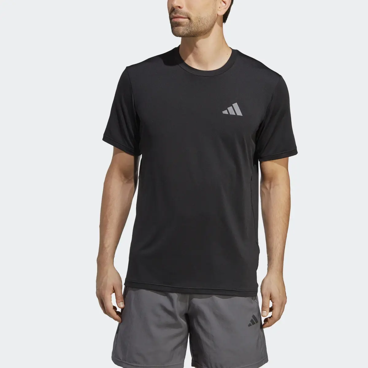 Adidas Train Essentials Seasonal Stretch Training Tee. 1