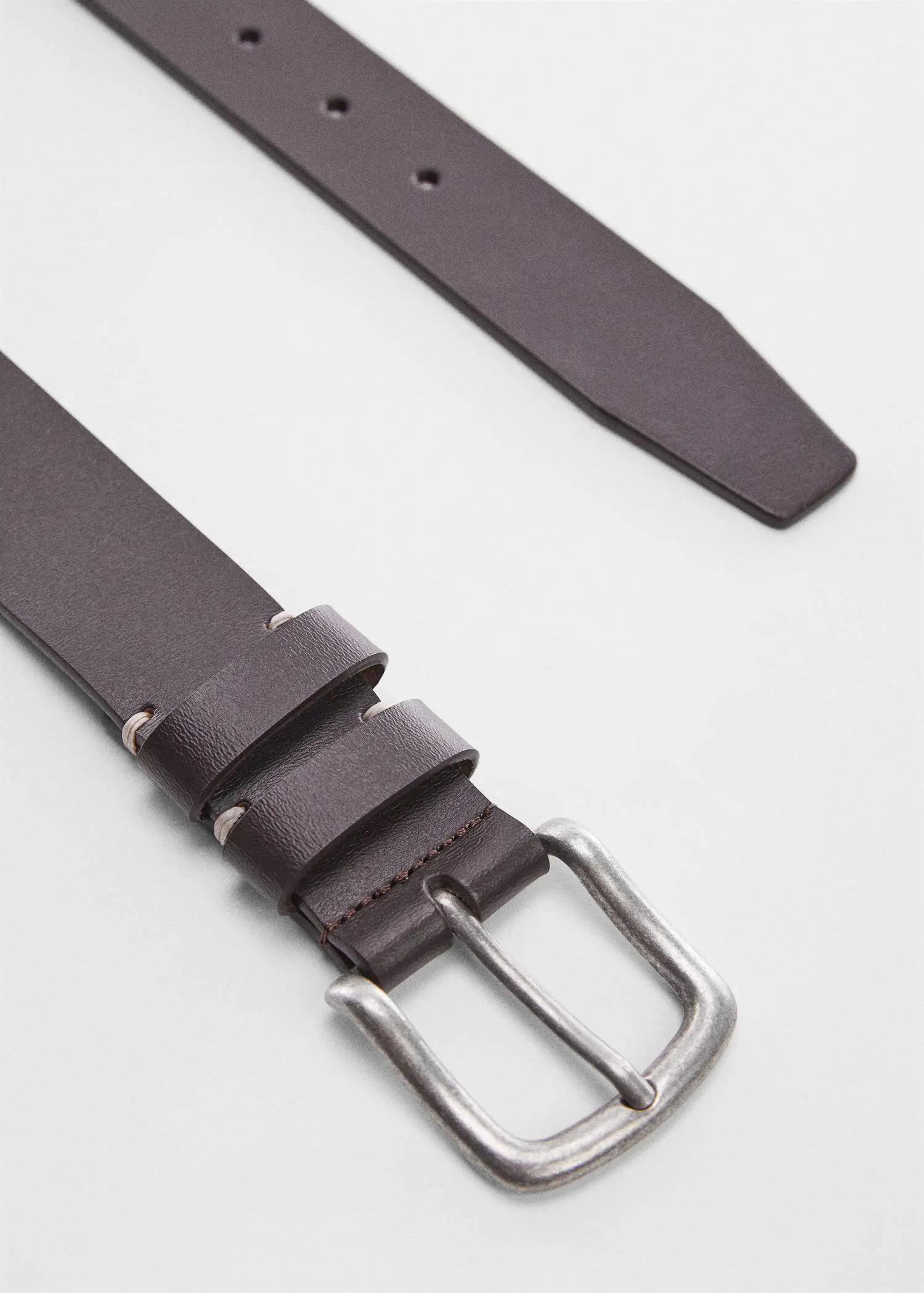 Mango Buckle leather belt. a close-up of a brown leather belt with a silver buckle. 