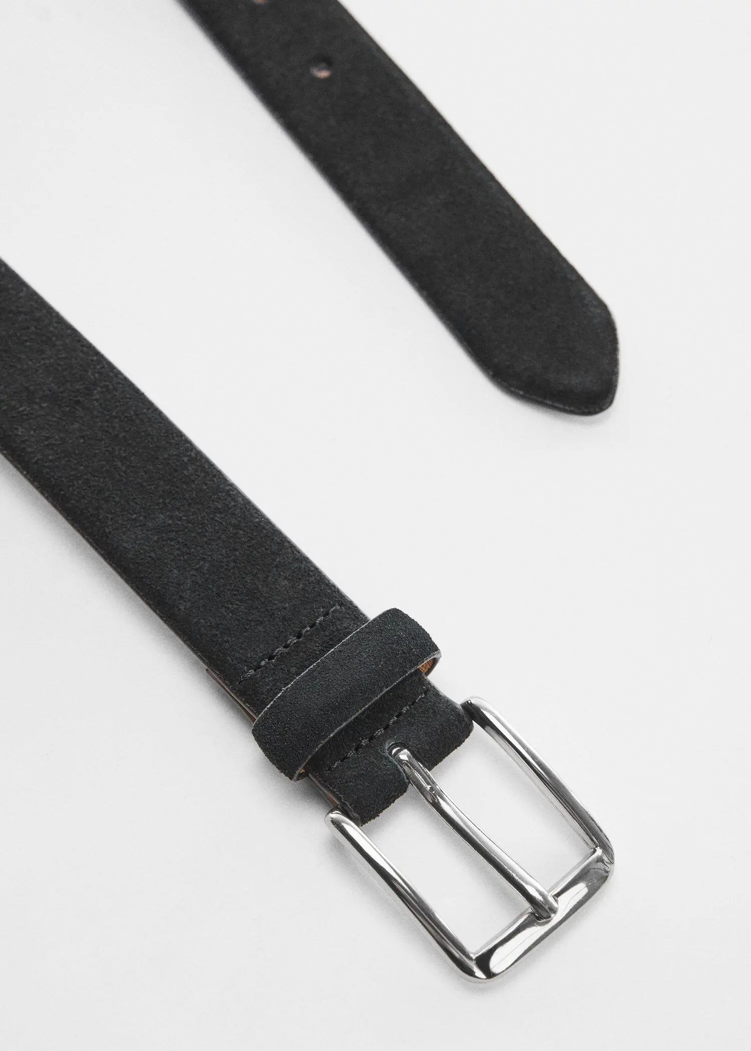 Mango Suede belt. a close-up of a black belt on a white surface. 