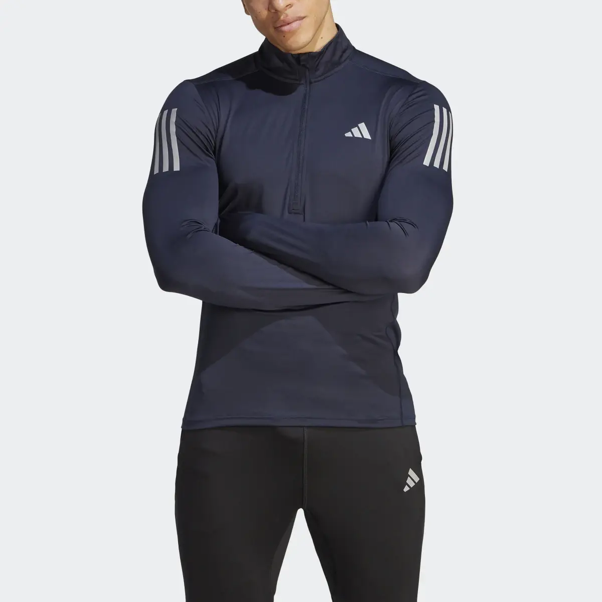 Adidas Own the Run 1/4 Zip Long Sleeve Sweatshirt. 1