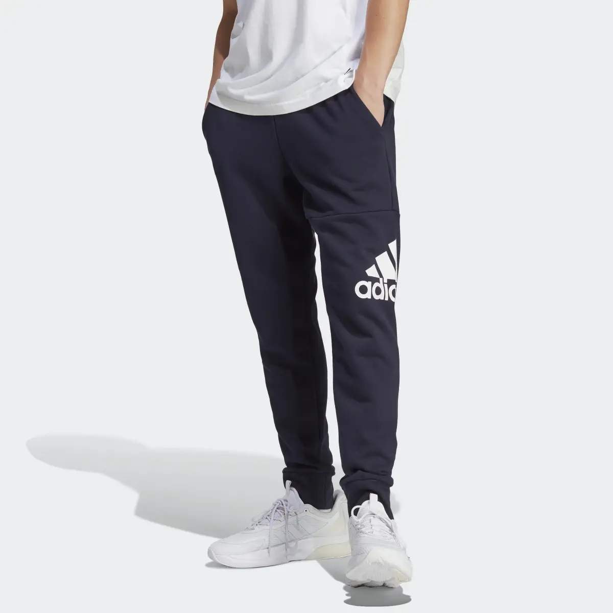 Adidas Essentials French Terry Tapered Cuff Logo Pants. 1