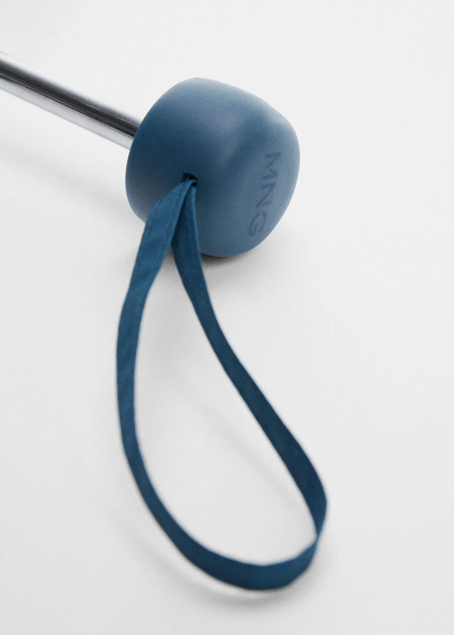 Mango Plain folding umbrella. a close-up of the end of a blue ribbon. 