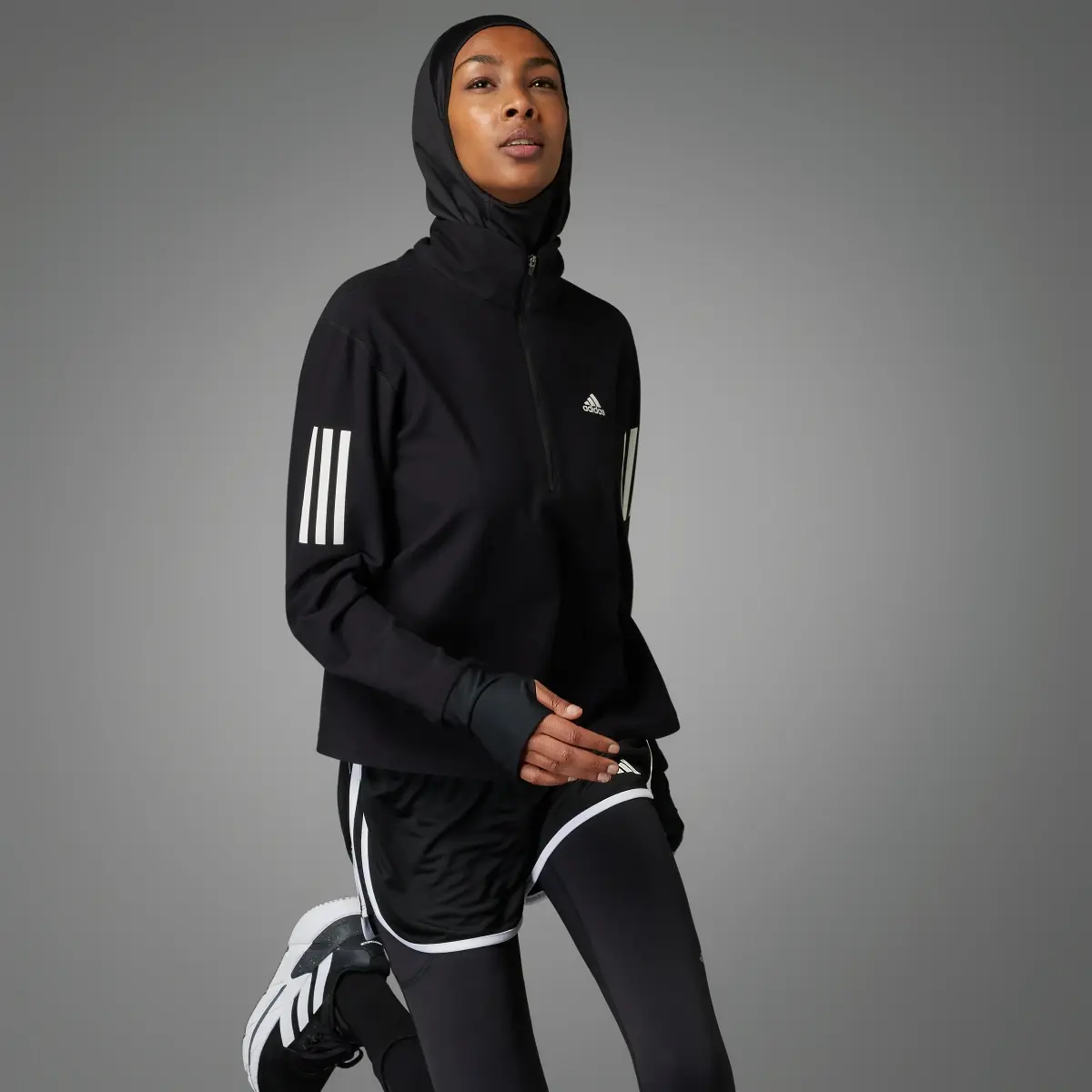 Adidas Own the Run Running 1/2 Zip Sweatshirt. 1