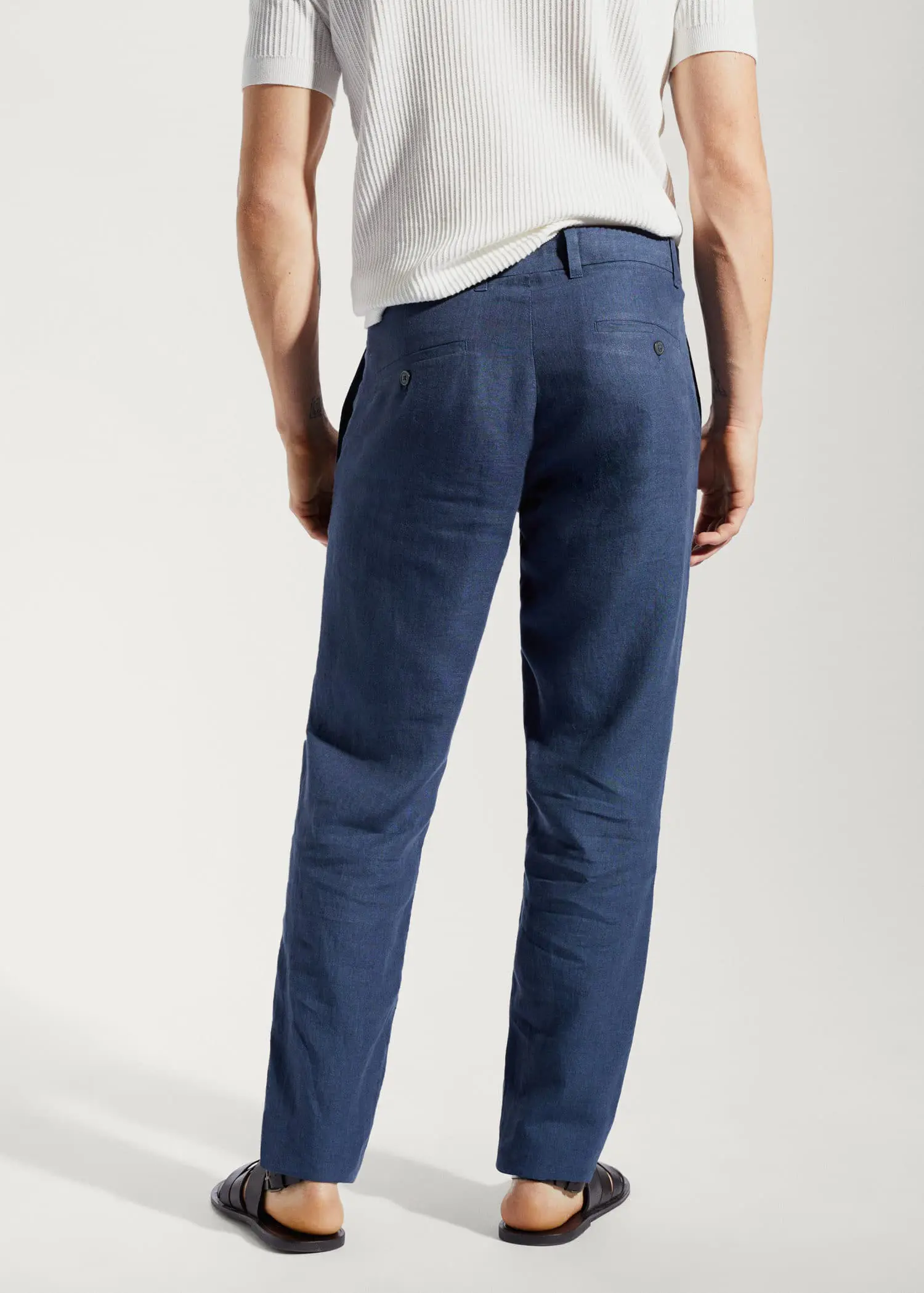 Mango Slim-fit 100% linen pants. a person wearing a white shirt and blue pants. 
