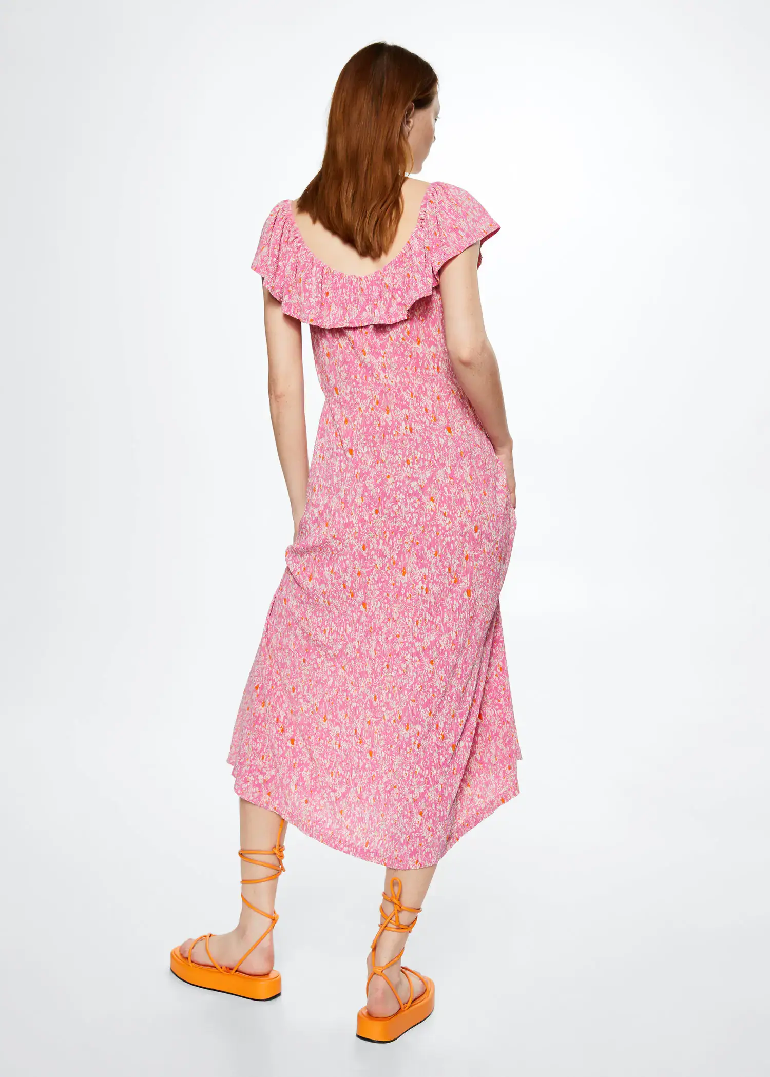 Mango Floral print dress. a woman in a pink dress standing in front of a white wall. 