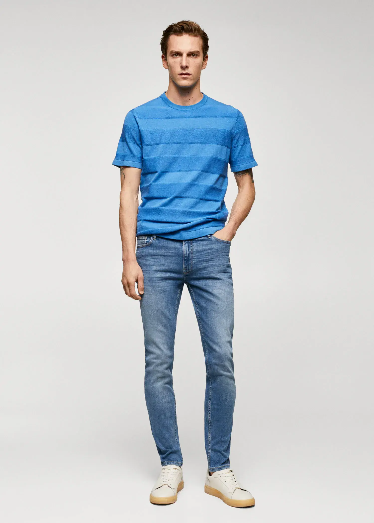 Mango Jude skinny-fit jeans. a man in a blue shirt and jeans. 