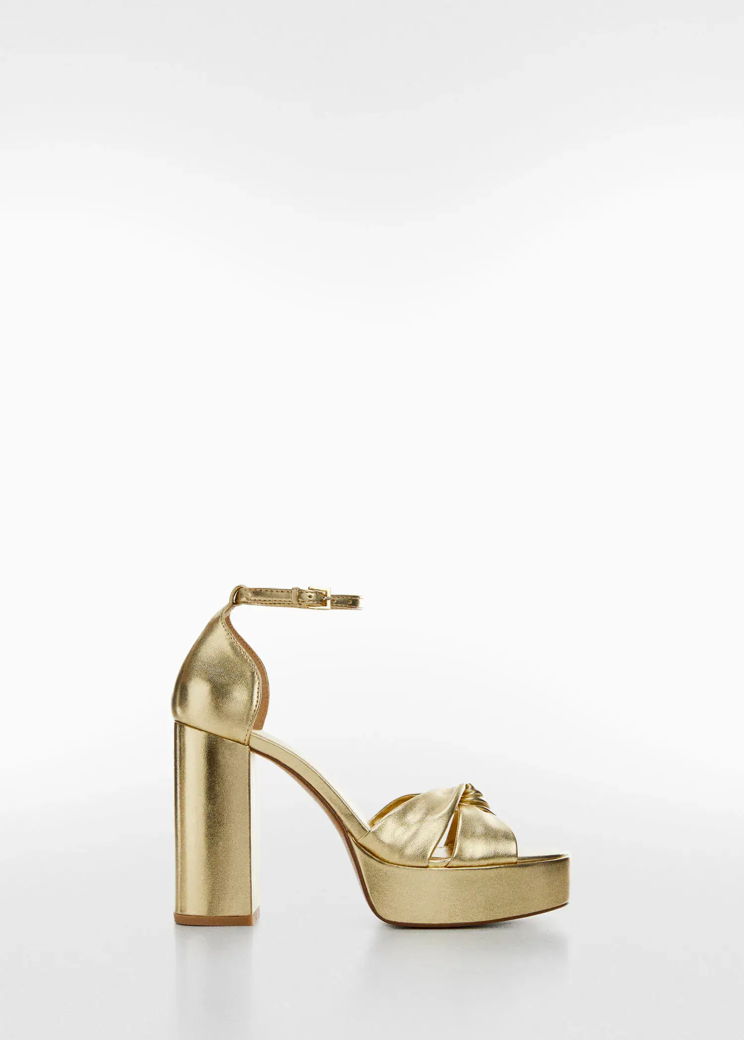 Mango Metallic heel sandals. a pair of gold high heeled shoes on a white background. 