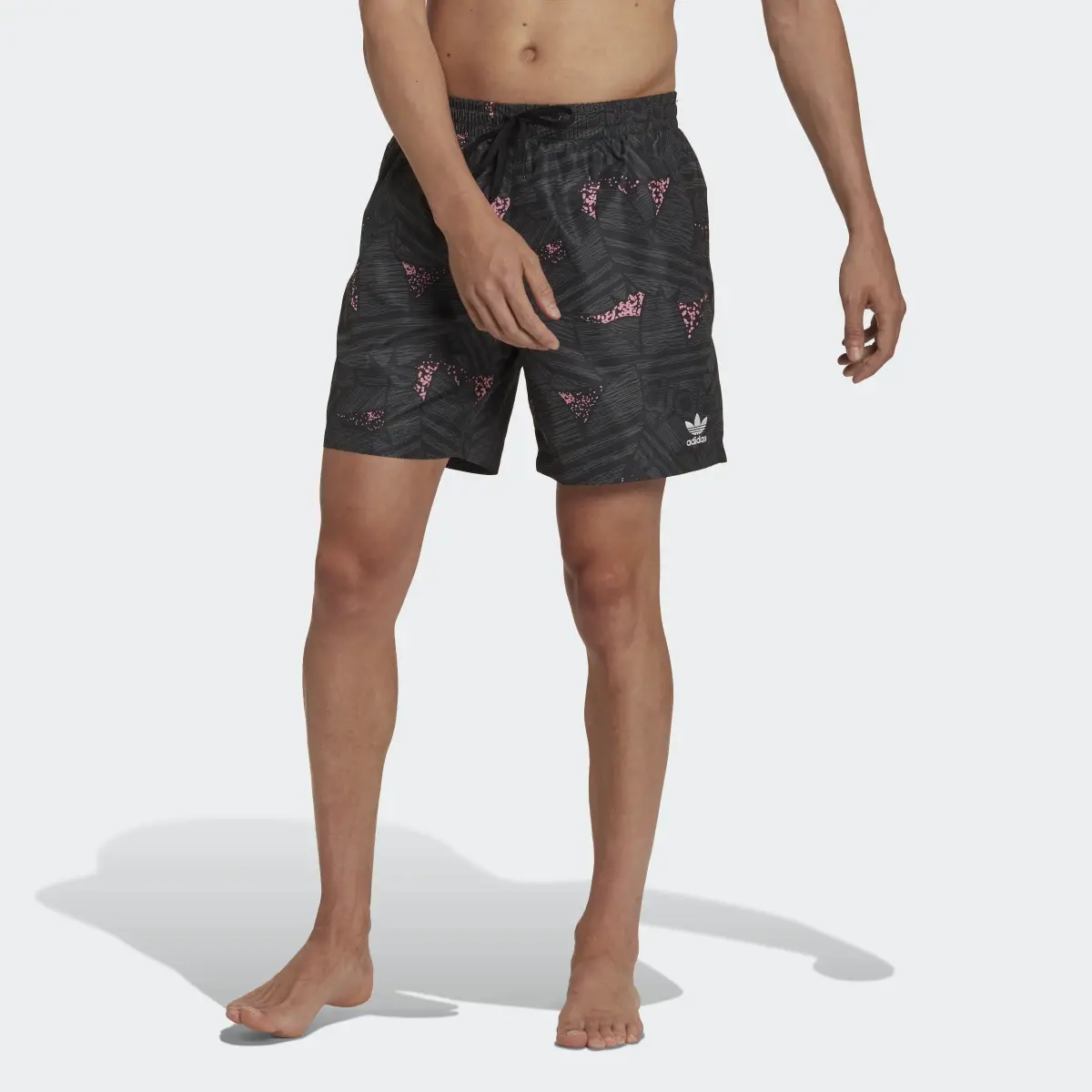 Adidas Rekive Allover Print Swim Shorts. 1