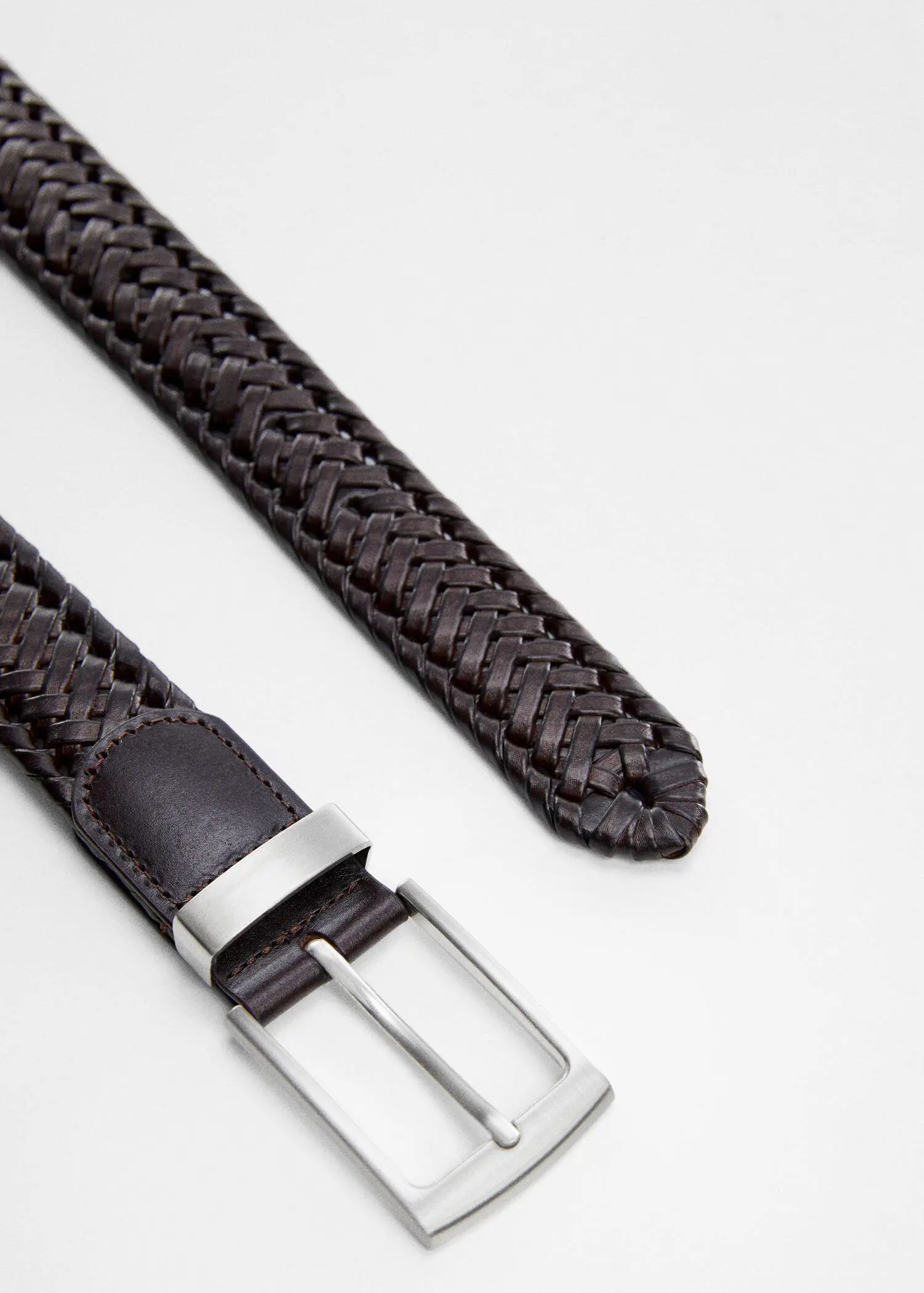 Mango Braided leather belt. a close-up of a brown belt with a silver buckle. 