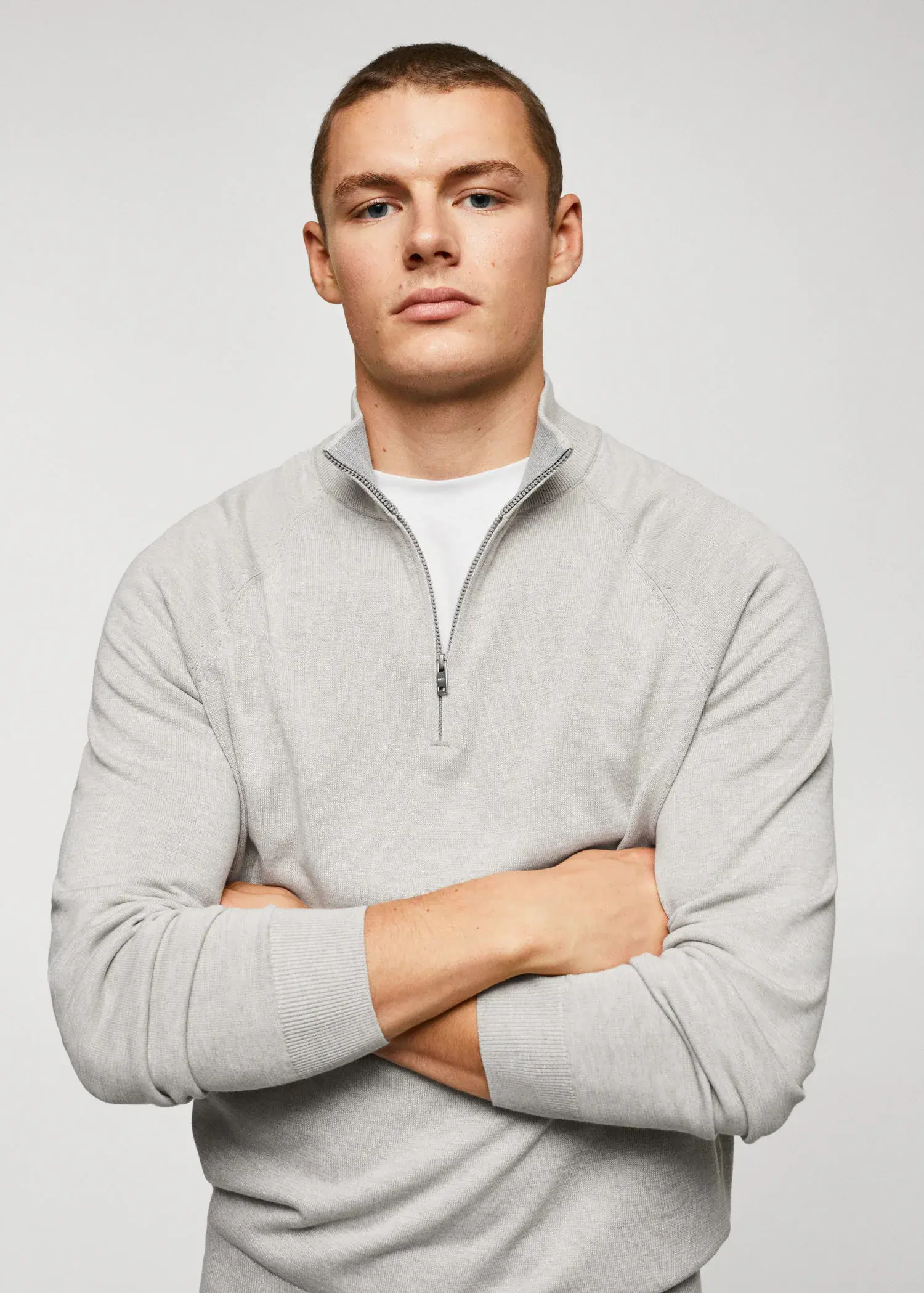 Mango Cotton sweater with neck zipper. a man with his arms crossed wearing a white shirt. 