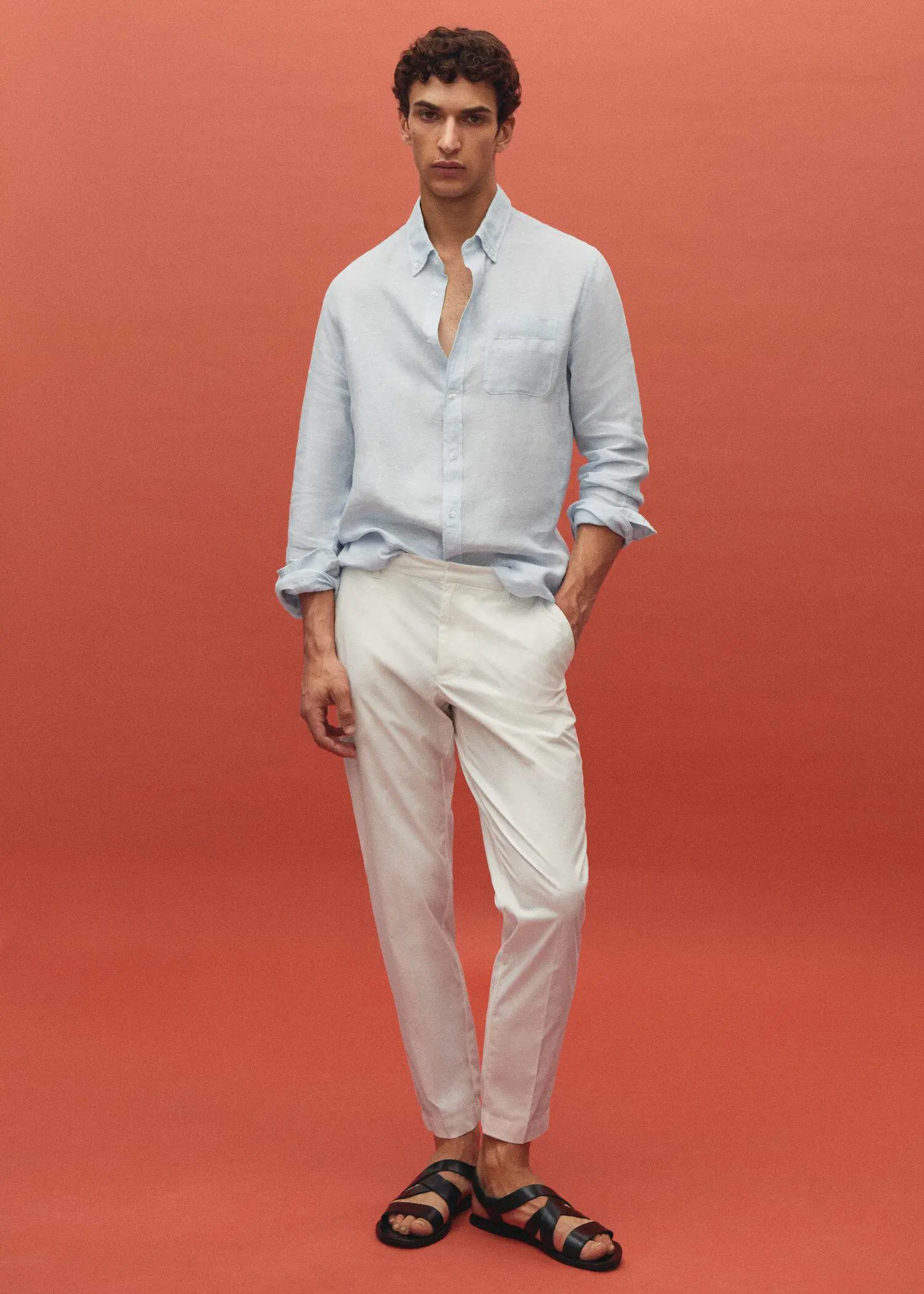 Mango Slim-fit cotton pants. a man wearing a light blue shirt and white pants. 