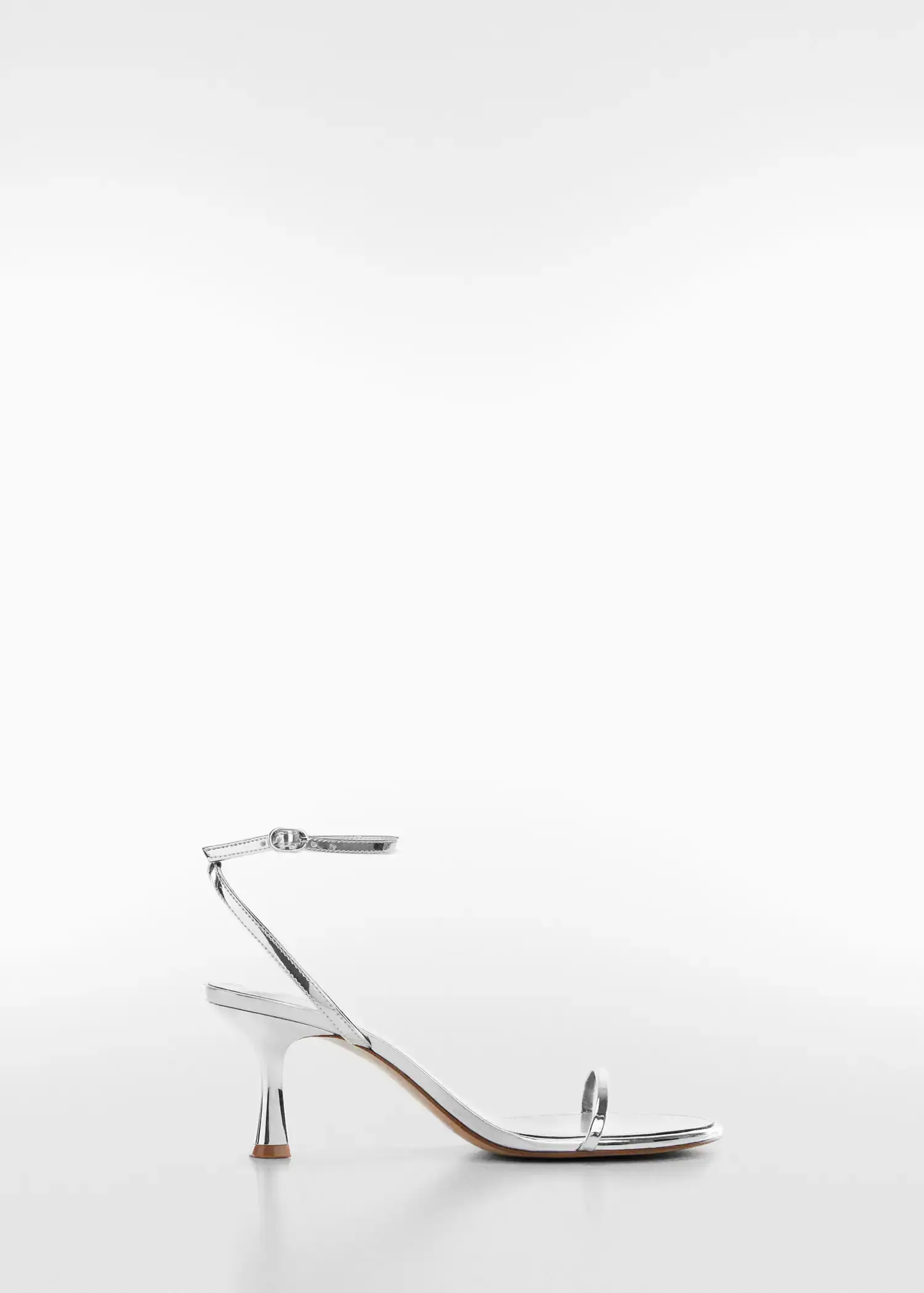 Mango Metallic heel sandals. a close up of a pair of pliers on a table 