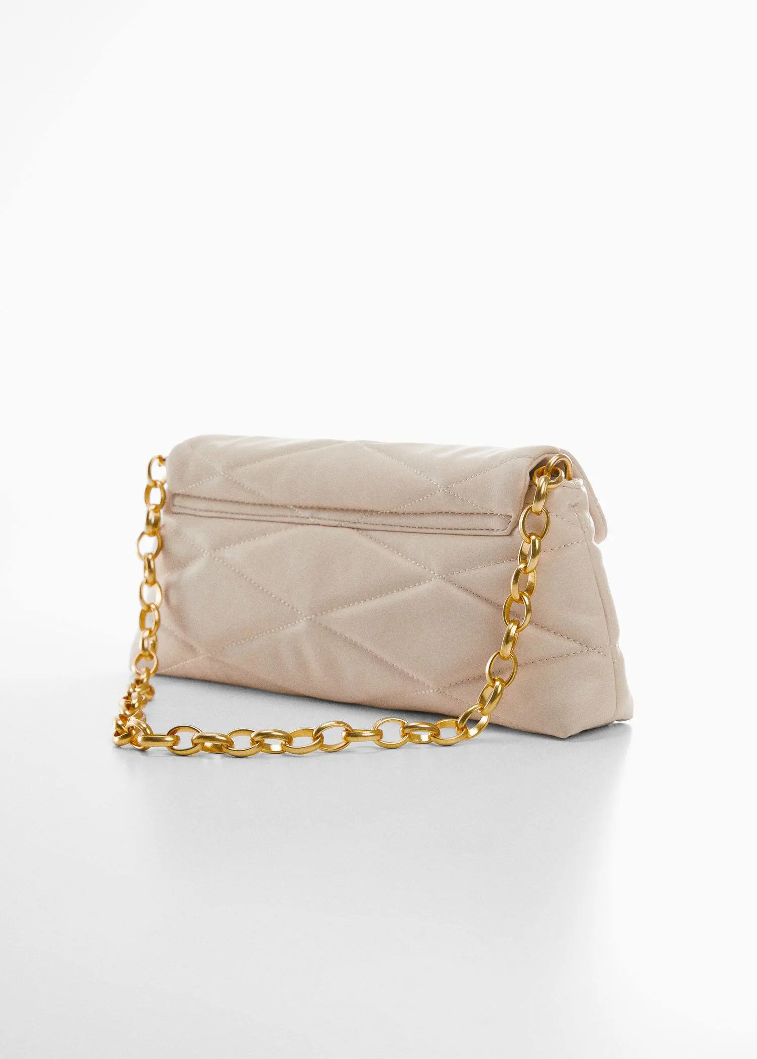 Mango Quilted bag with chain handle. a white purse with a gold chain on top of it. 
