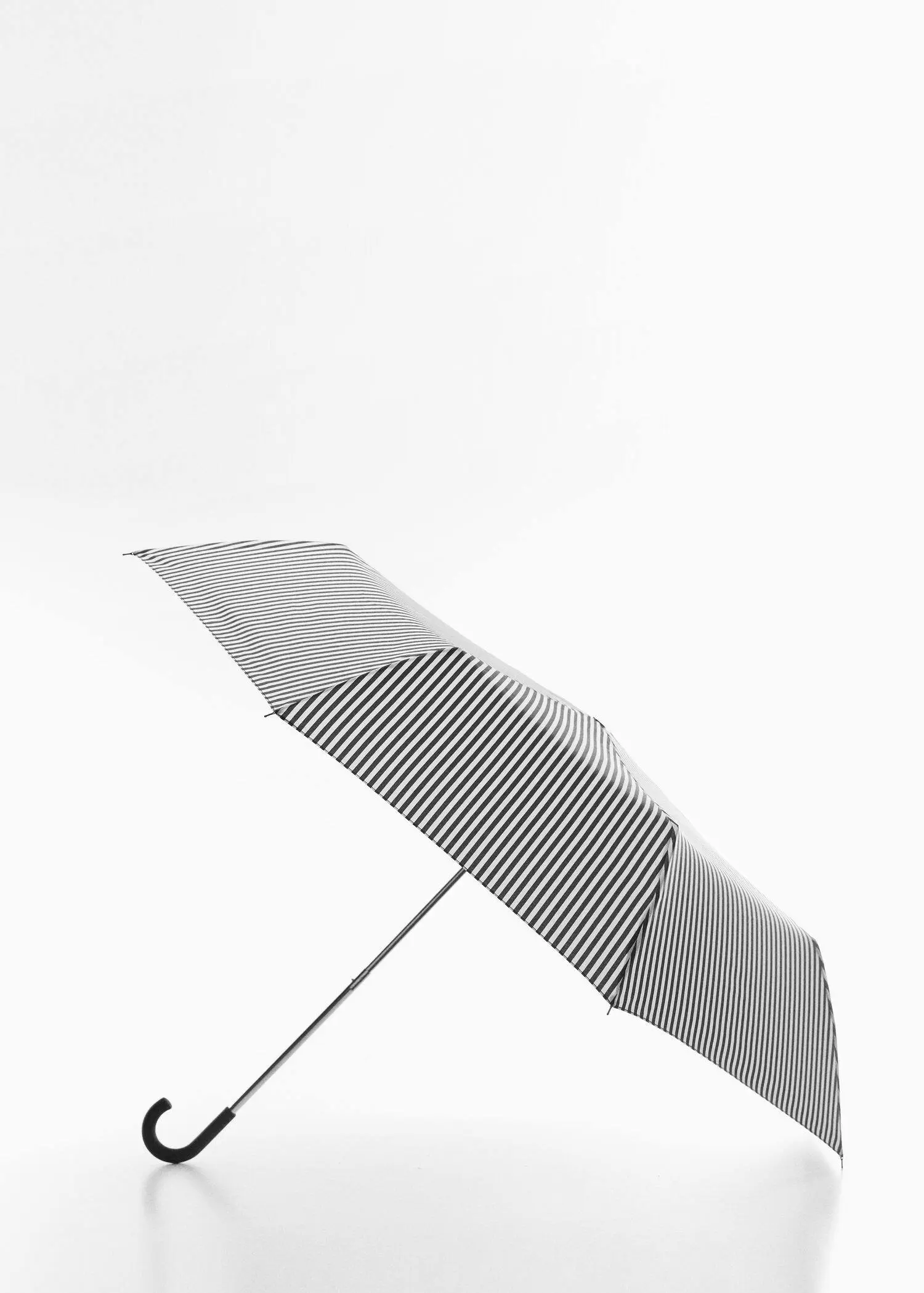 Mango Striped folding umbrella. an open umbrella with black and white stripes. 