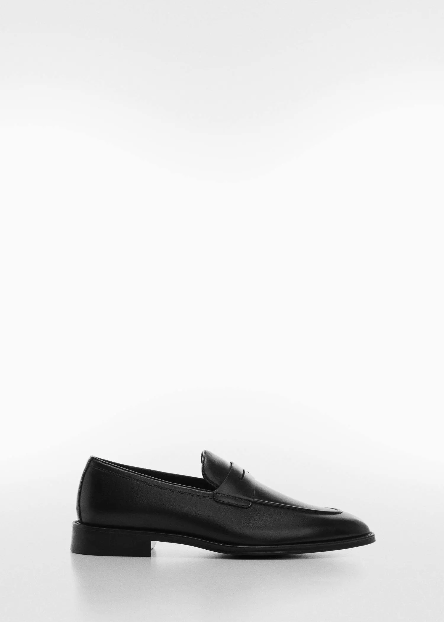 Mango Aged-leather loafers. a pair of black shoes on a white background. 