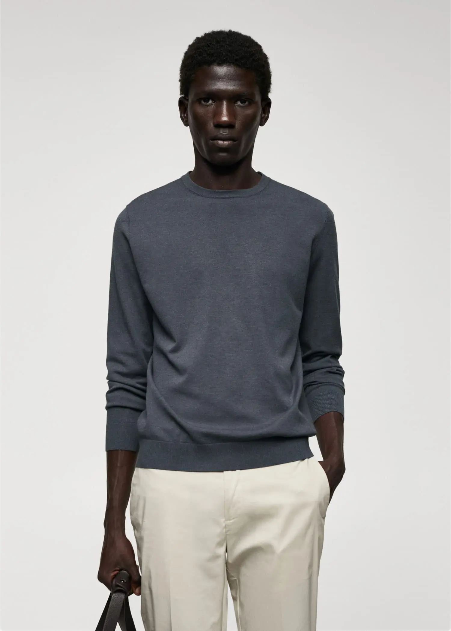 Mango Fine-knit sweater. a man wearing a gray sweater and white pants. 