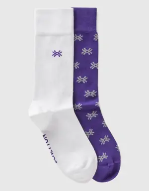 two pairs of white and purple socks