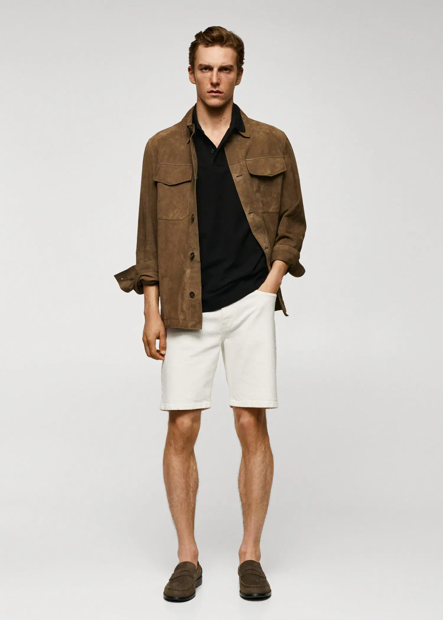 Mango 100% cotton pique polo shirt. a man in a brown jacket and white shorts. 