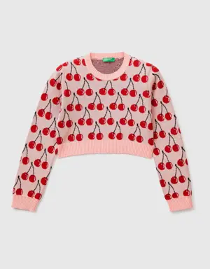 pink cropped sweater with cherry pattern
