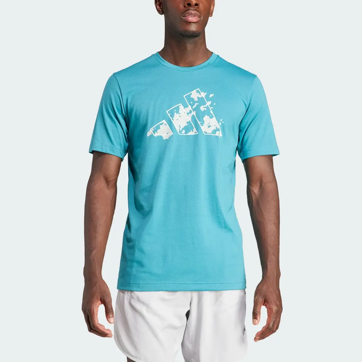 Adidas Playera de entrenamiento Essentials Seasonal Graphic Tee. 1