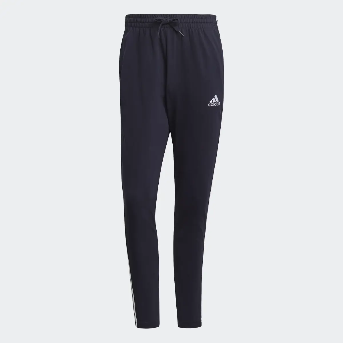 Adidas Pants Essentials 3 Franjas Tejido Jersey Puños Abiertos. 1