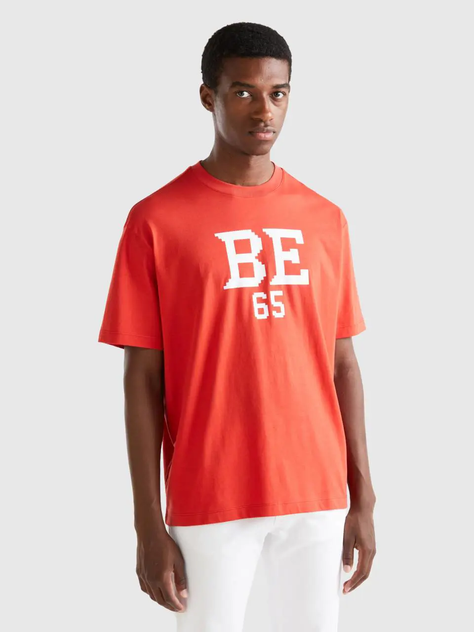 Benetton red t-shirt with "be" print. 1