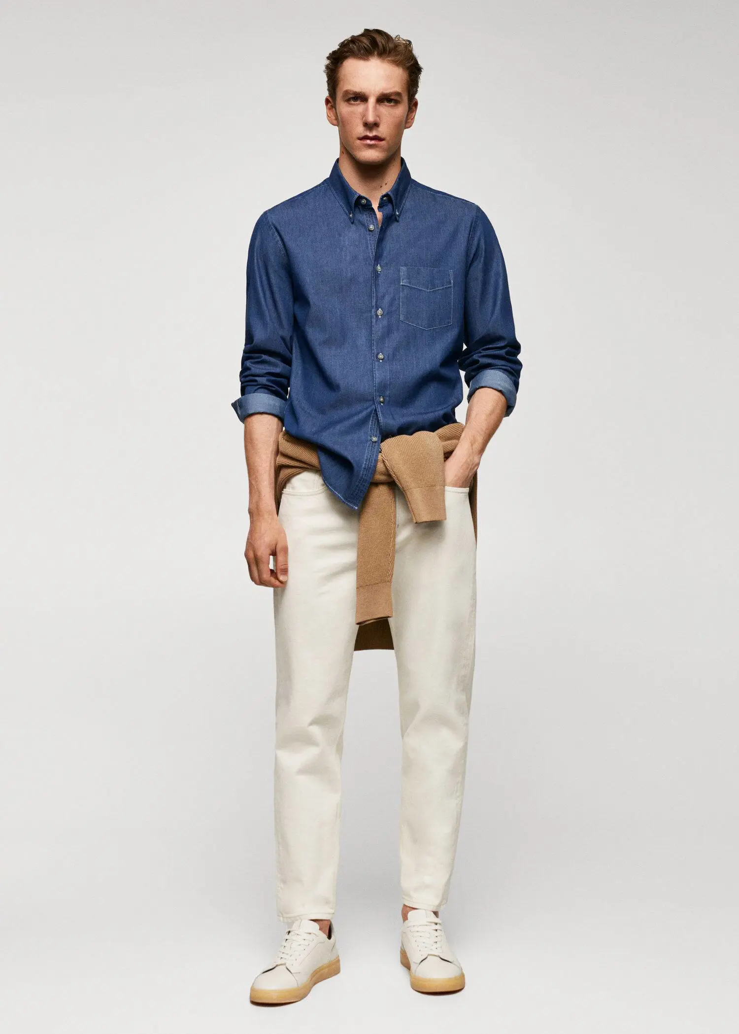 Mango Slim-fit denim skirt with pockets. a man wearing a blue shirt and white pants. 