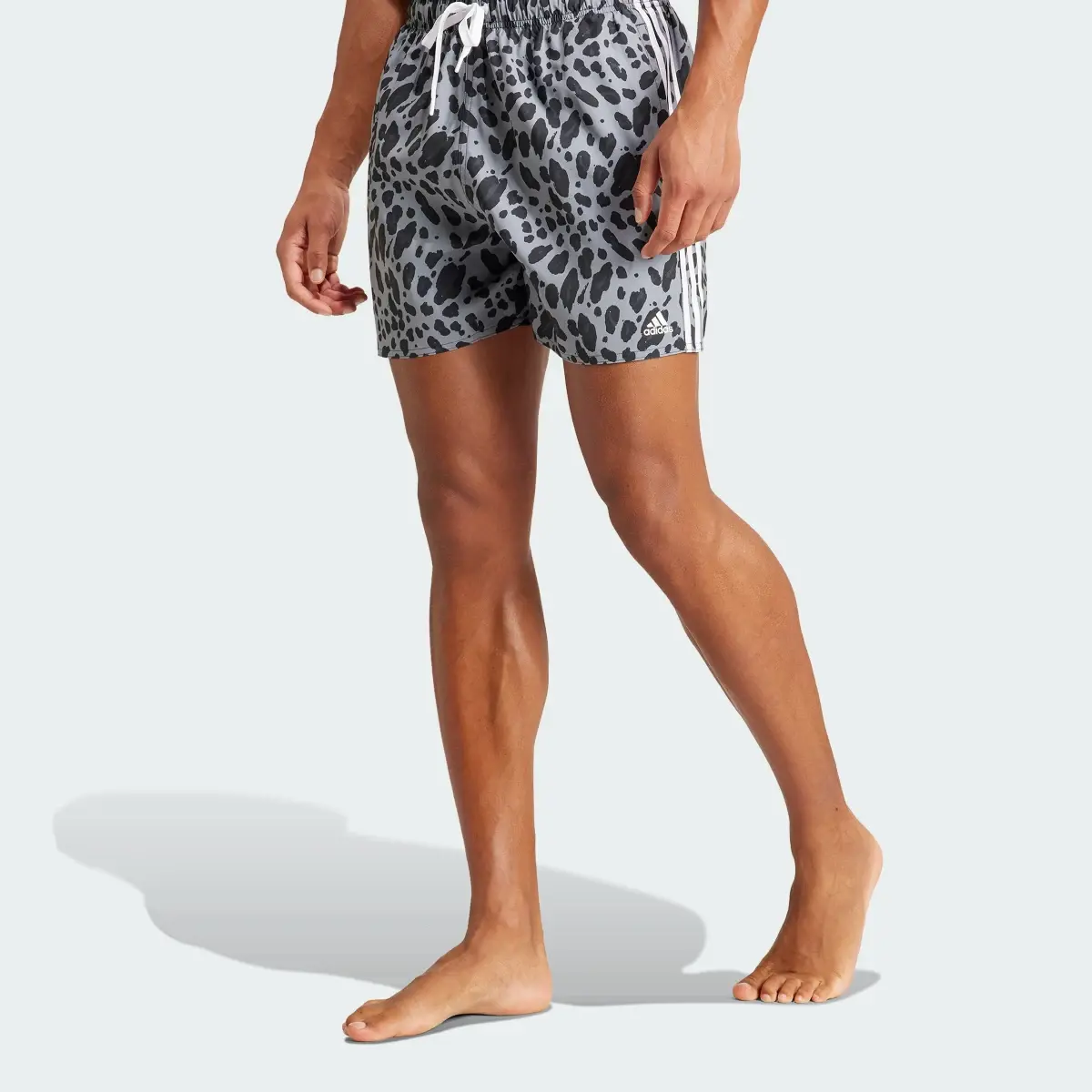 Adidas Essentials 3-Stripes Animal-Print CLX Swim Shorts. 1