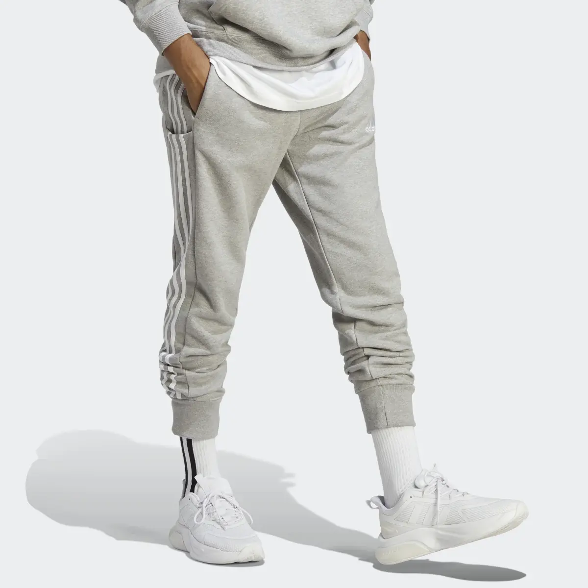Adidas Pantaloni Essentials French Terry Tapered Cuff 3-Stripes. 3
