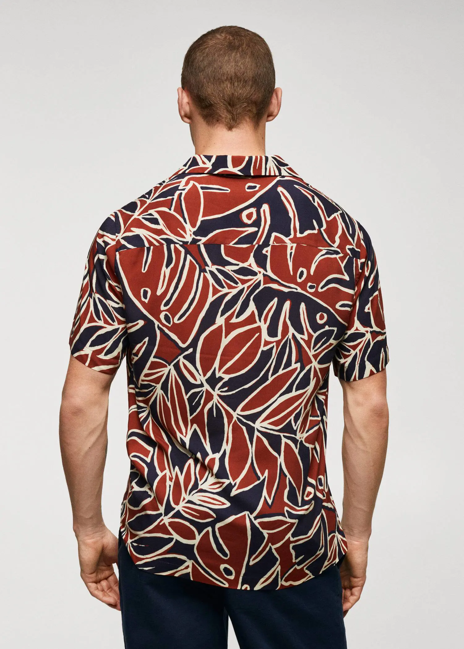 Mango Bowling shirt with leaf print. a man wearing a red and black shirt. 
