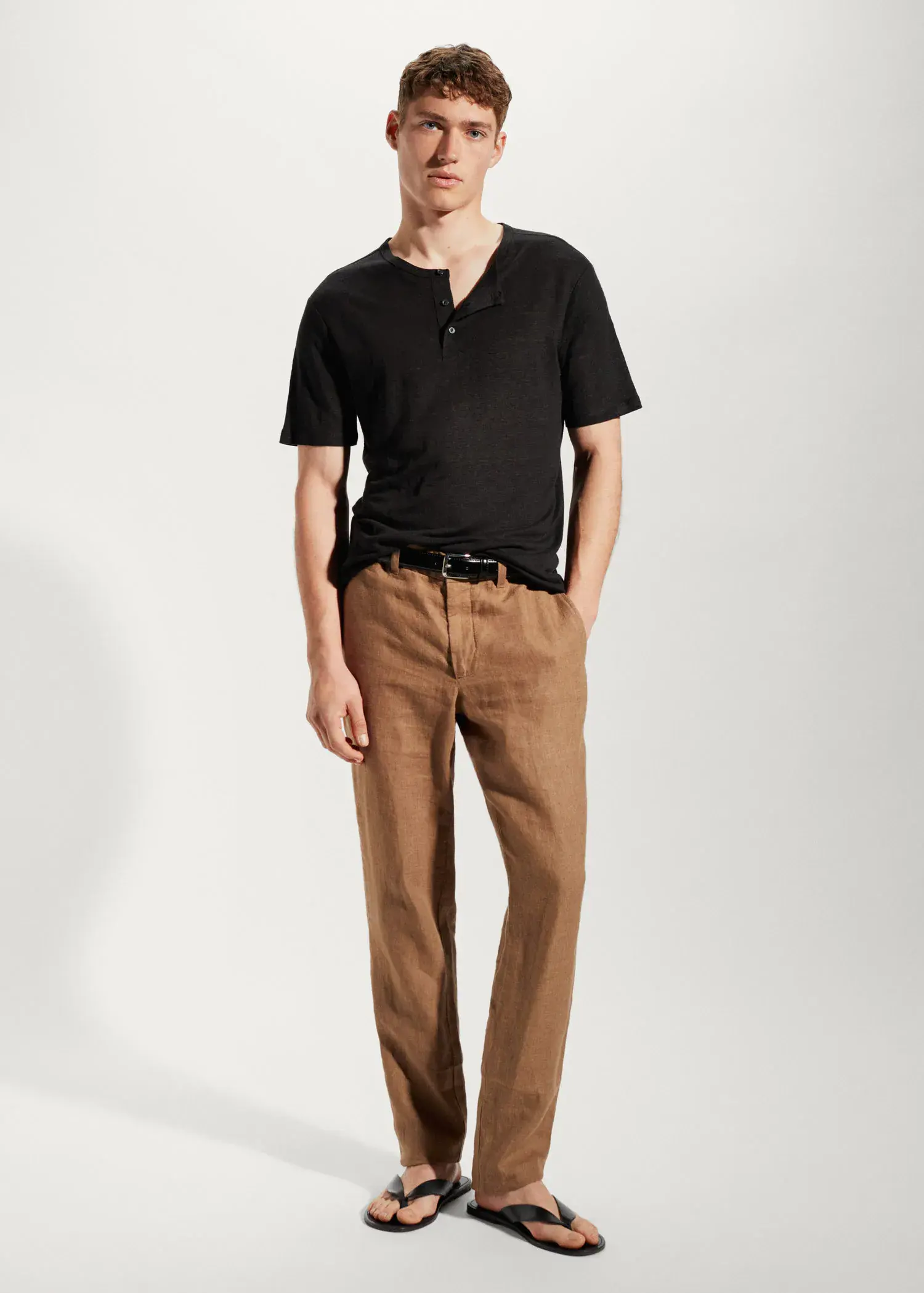 Mango 100% linen Henley t-shirt. a man in black shirt and brown pants. 
