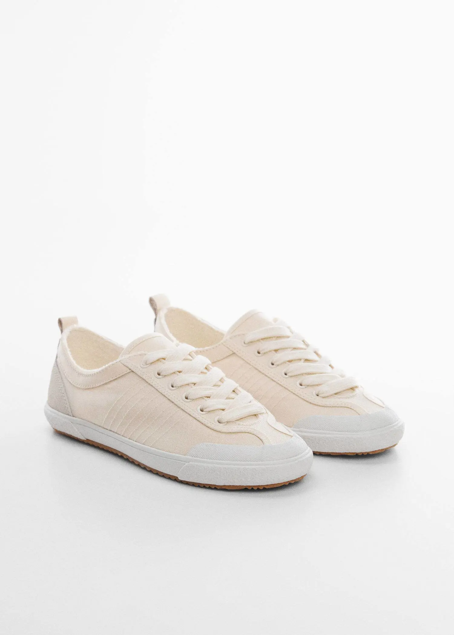 Mango Decorative seam sneakers. a pair of white sneakers on a white surface. 