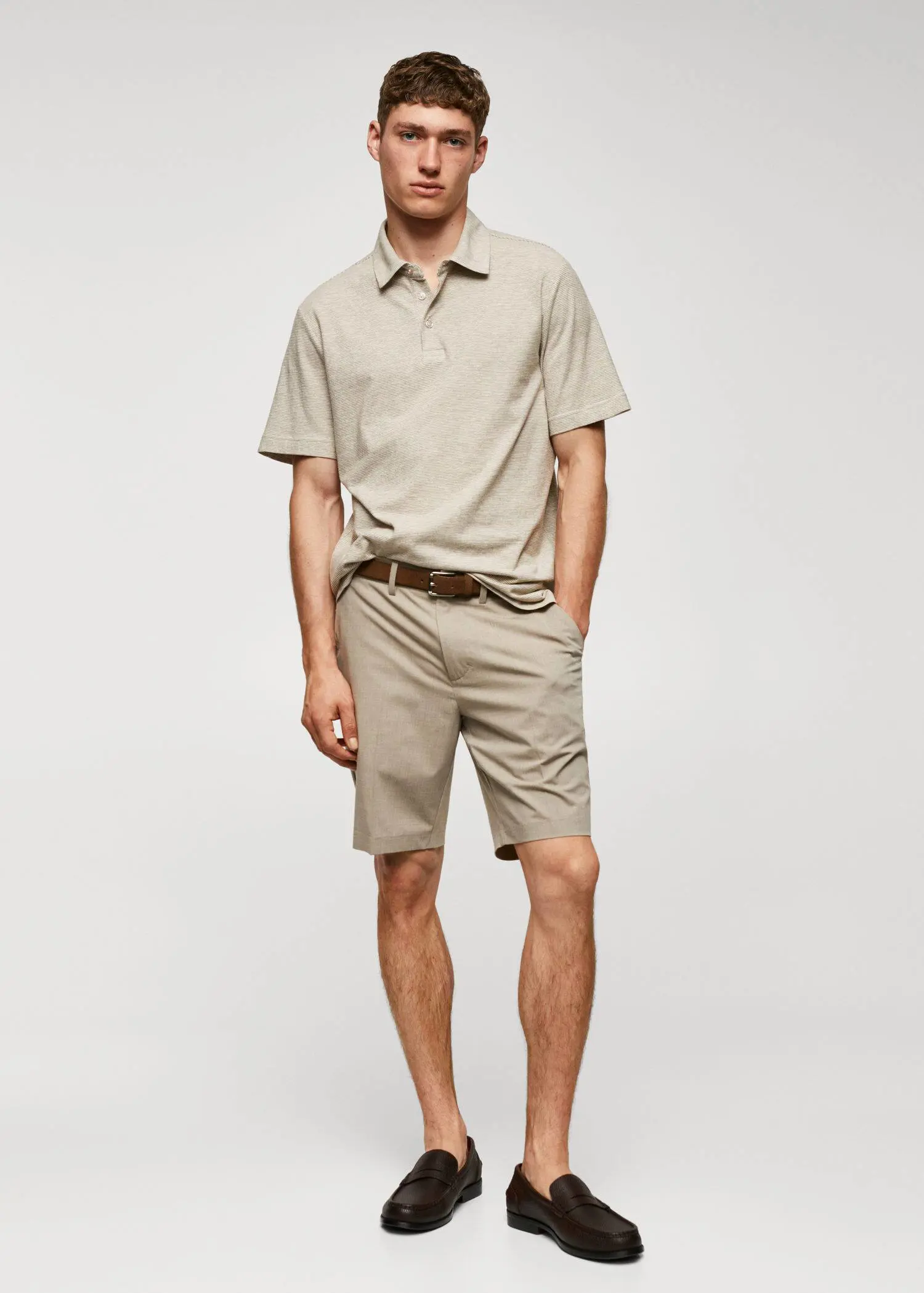 Mango 100% cotton polo shirt with striped structure. a man in a tan shirt and tan shorts. 