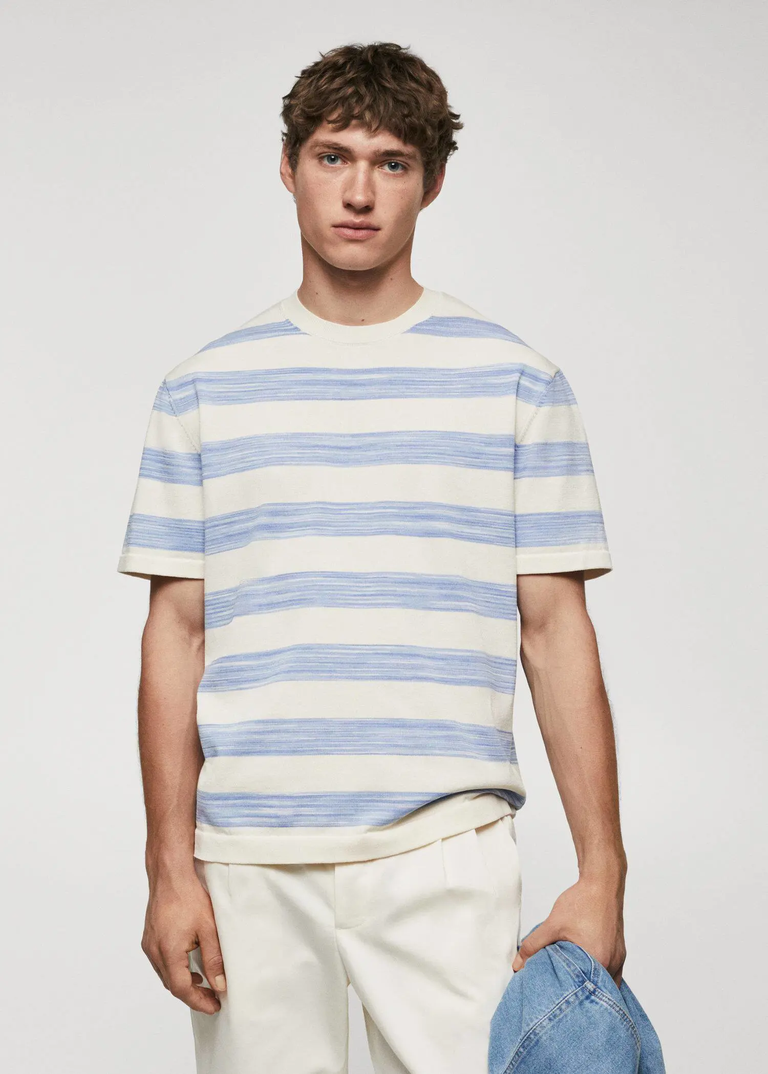 Mango Striped jersey T-shirt. a young man wearing a blue and white striped shirt. 