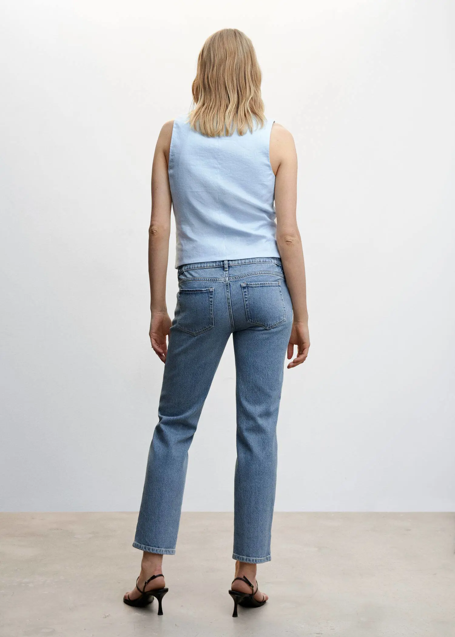 Mango Maternity Straight Jeans. a woman in a light blue shirt and jeans. 