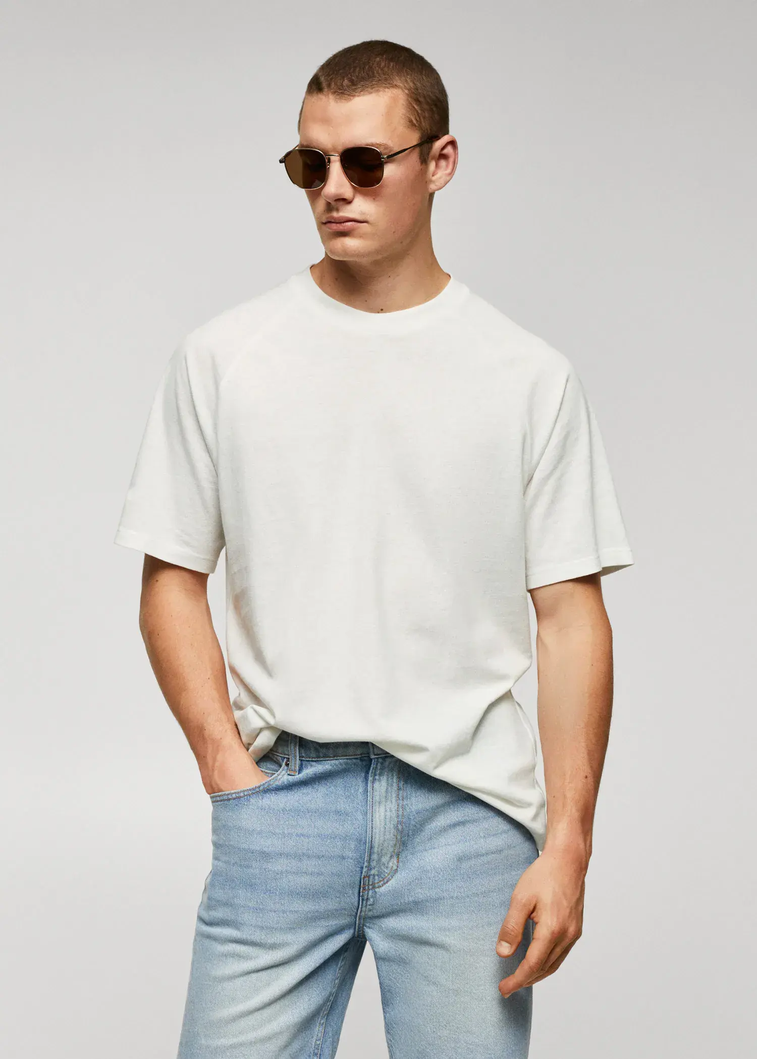 Mango Textured cotton-linen t-shirt. a man in a white shirt and sunglasses. 