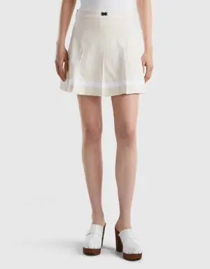 creamy white pleated mini skirt