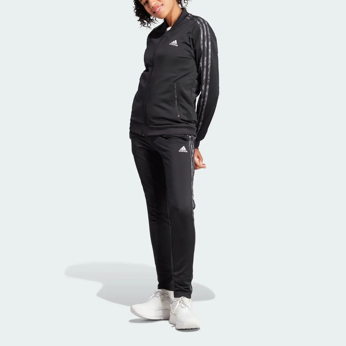 Adidas Essentials 3-Streifen Trainingsanzug. 1