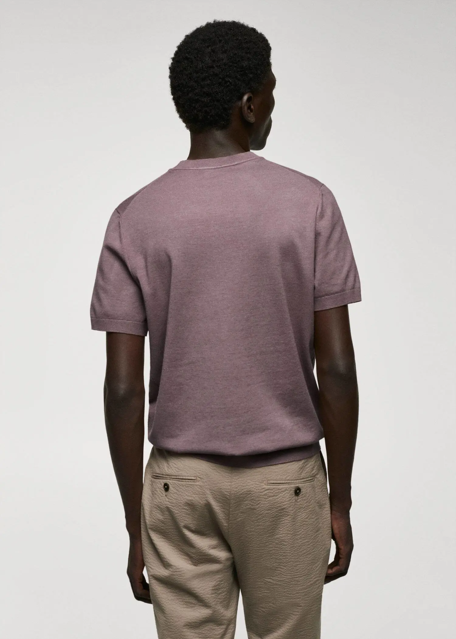 Mango Fine-knit T-shirt. a man wearing a purple shirt and beige shorts. 
