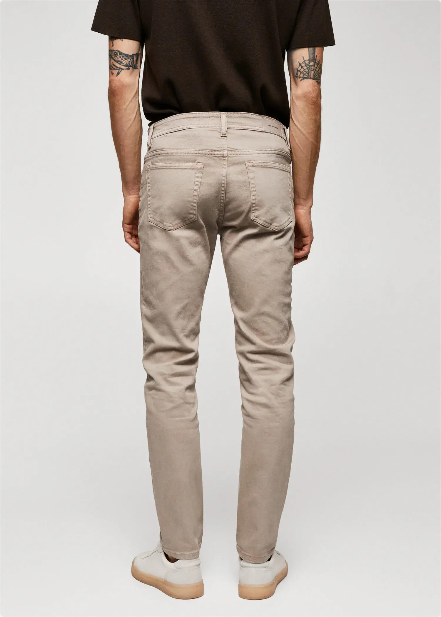 Mango Jan slim-fit jeans. a person wearing a pair of beige pants. 