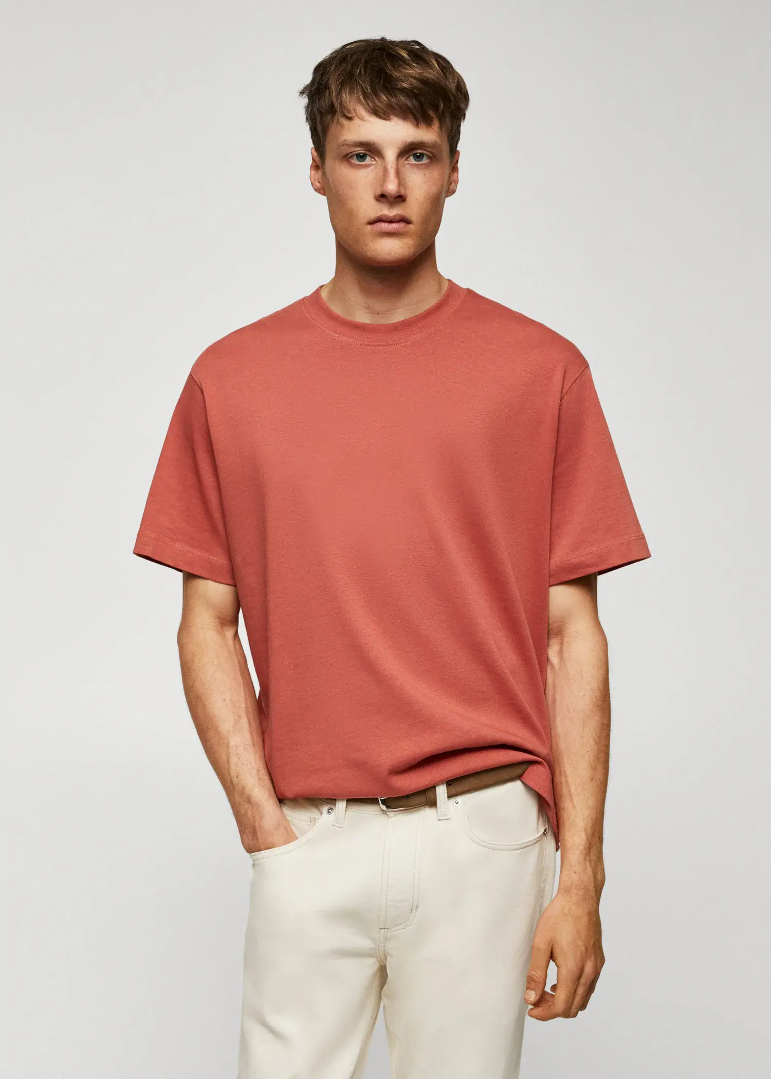 Mango Basic 100% cotton relaxed-fit t-shirt. a man wearing a red shirt and white pants. 