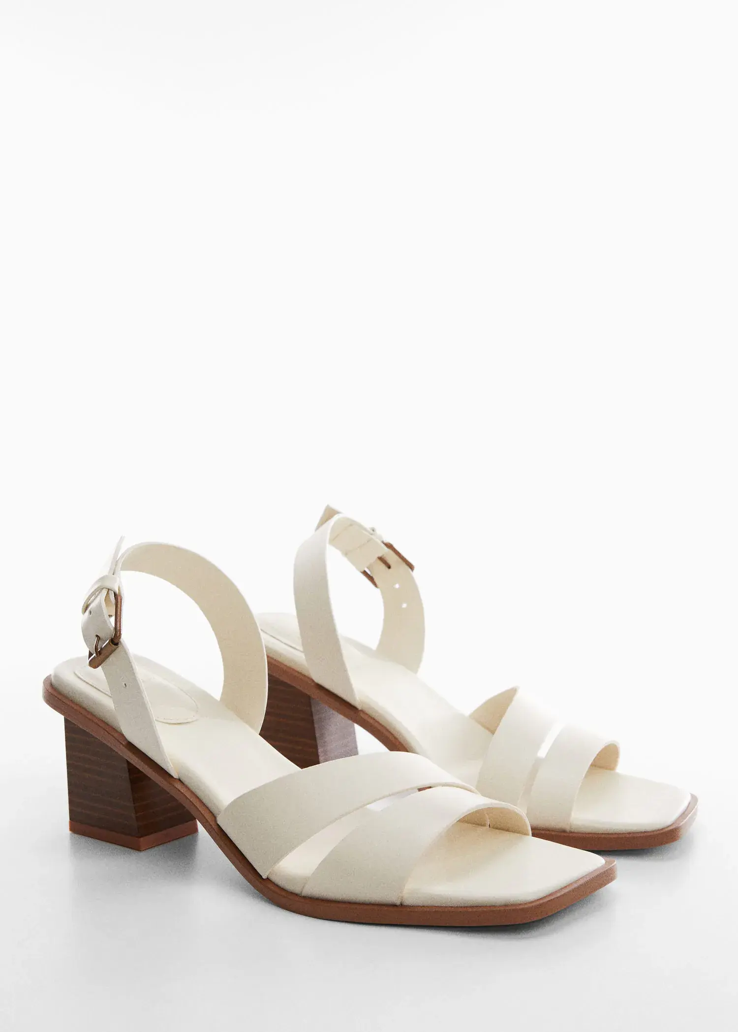 Mango Block-heel sandals. a pair of white sandals sitting on top of a table. 