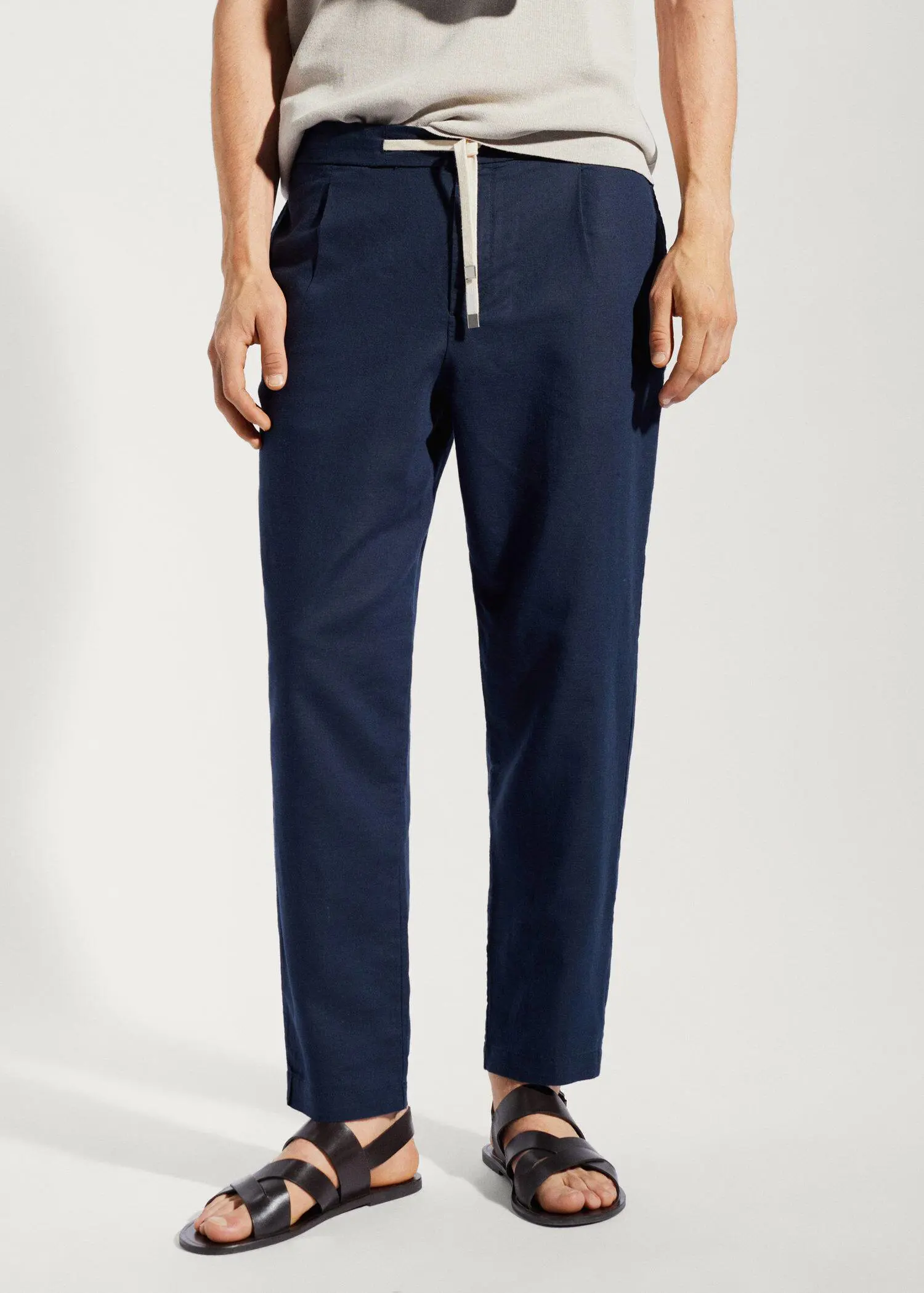 Mango Slim-fit trousers with drawstring . a person standing wearing a pair of pants. 
