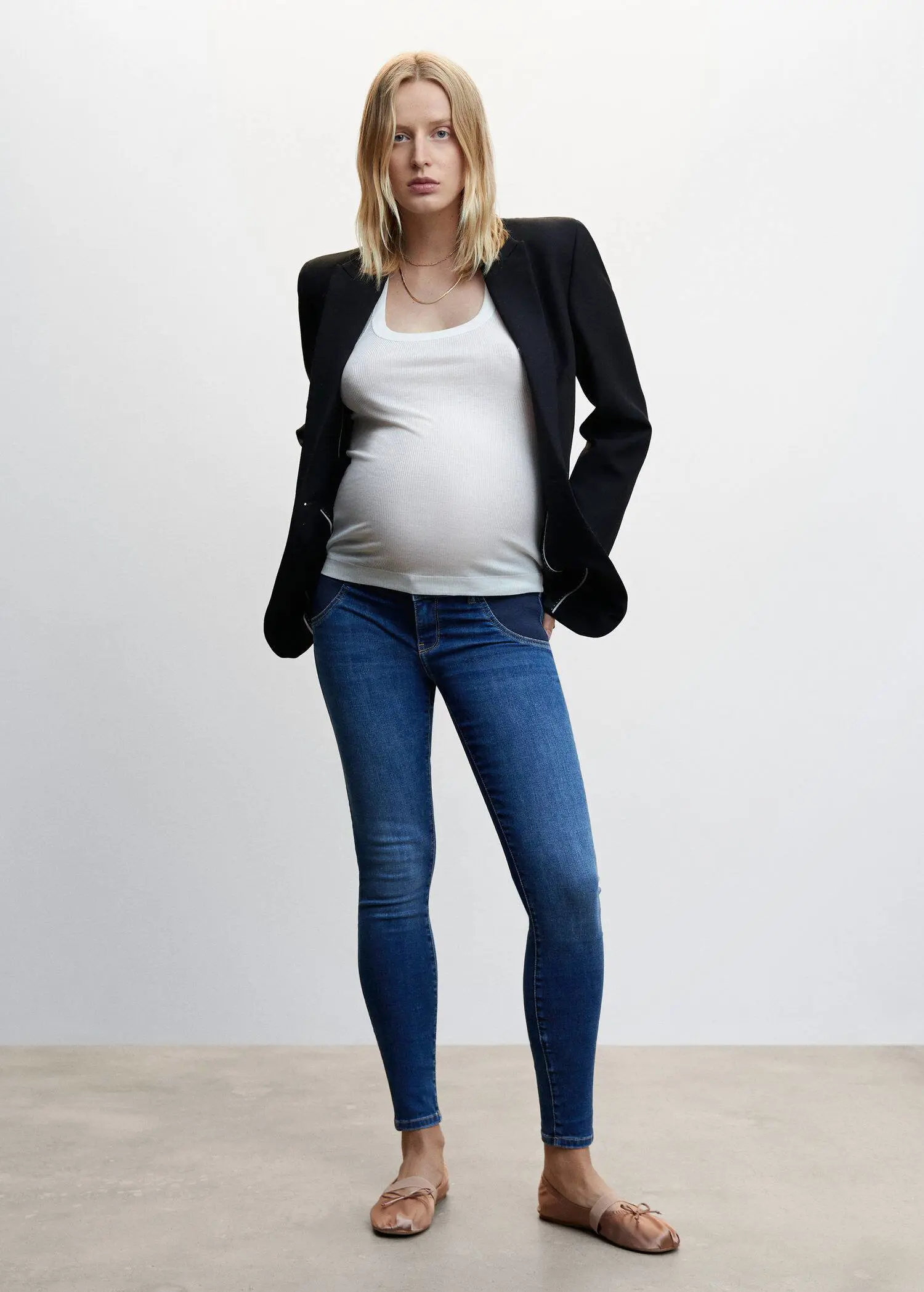 Mango Maternity skinny jeans. a pregnant woman wearing jeans and a jacket. 