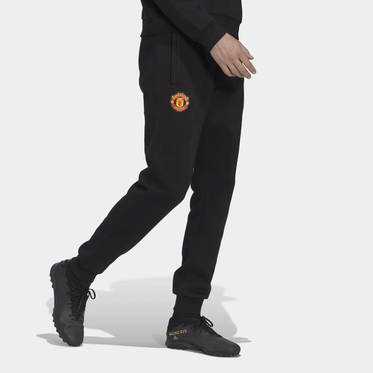 Adidas Manchester United Essentials Trefoil Tracksuit Bottoms. 1