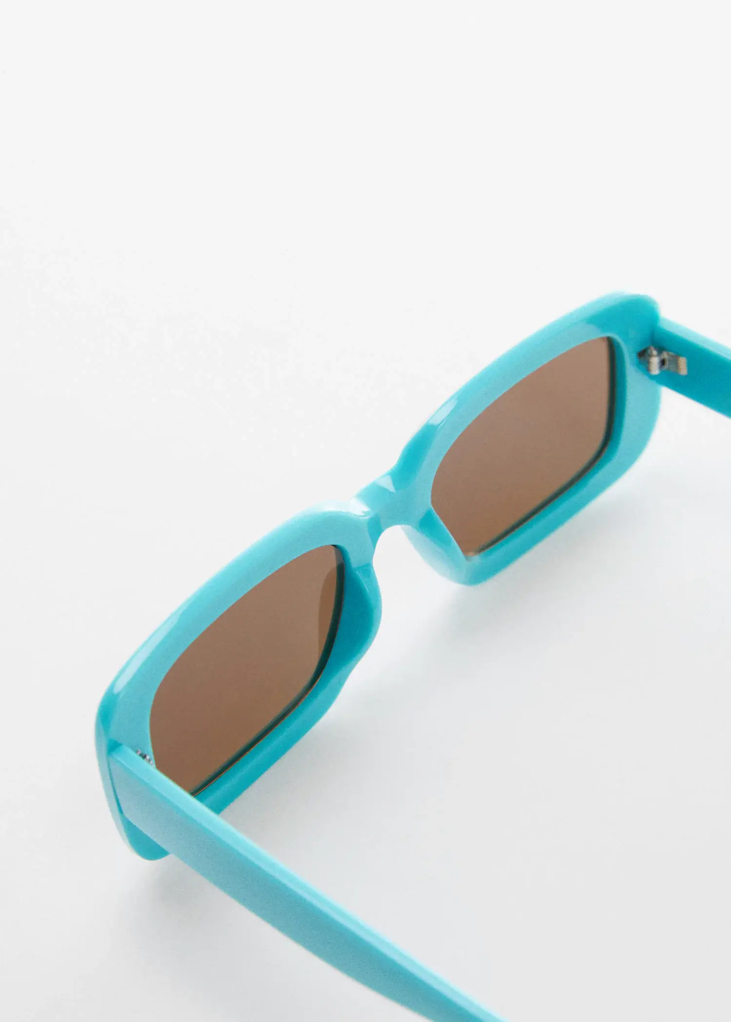 Mango Rectangular sunglasses. a close up of a pair of blue sunglasses. 