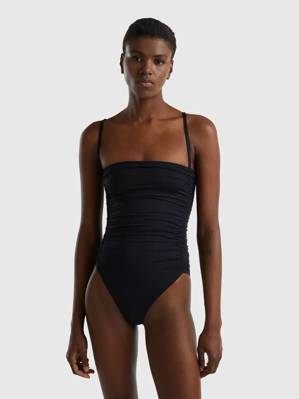 Benetton one-piece swimsuit in econyl® with draping. 1